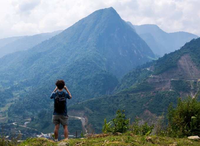 tourist taking a photo of the mountains in sapa vietnam
