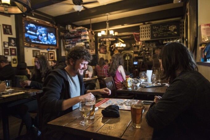 people playing board games at storm crow tavern
