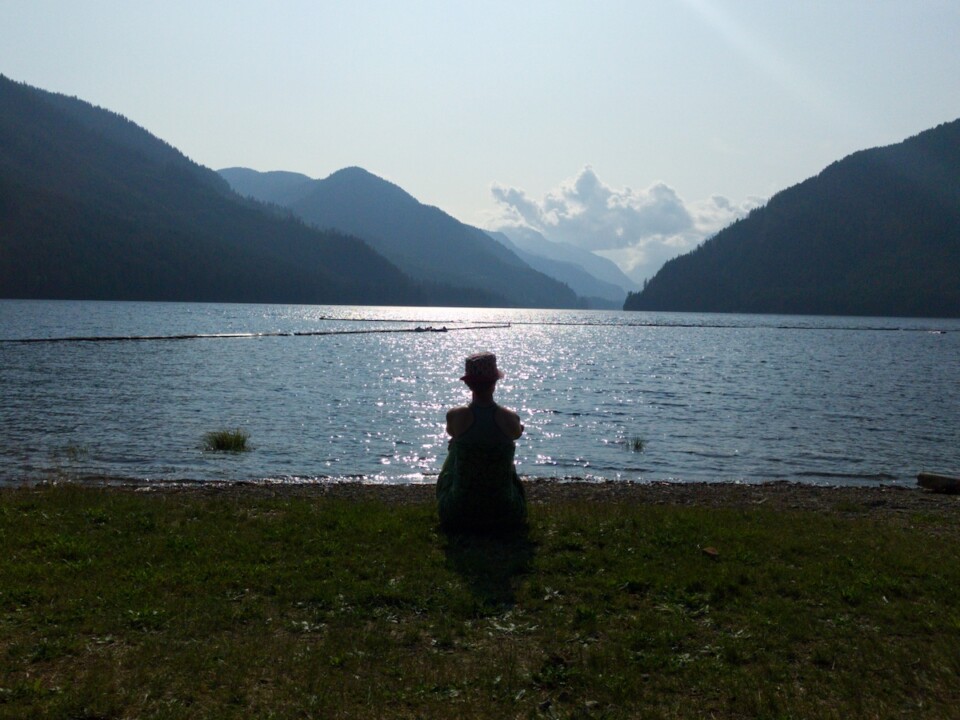 woman looking out over a lake