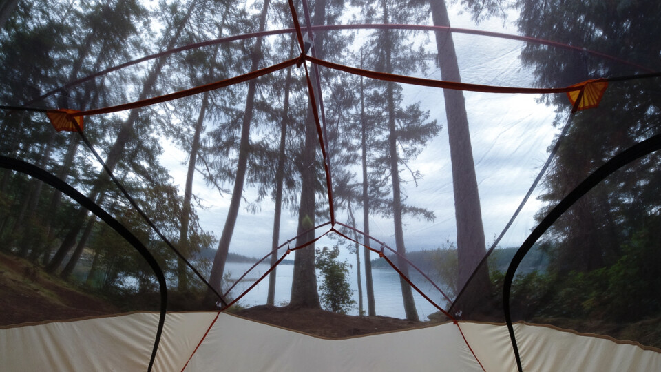 view from inside a tent overlooking the ocean